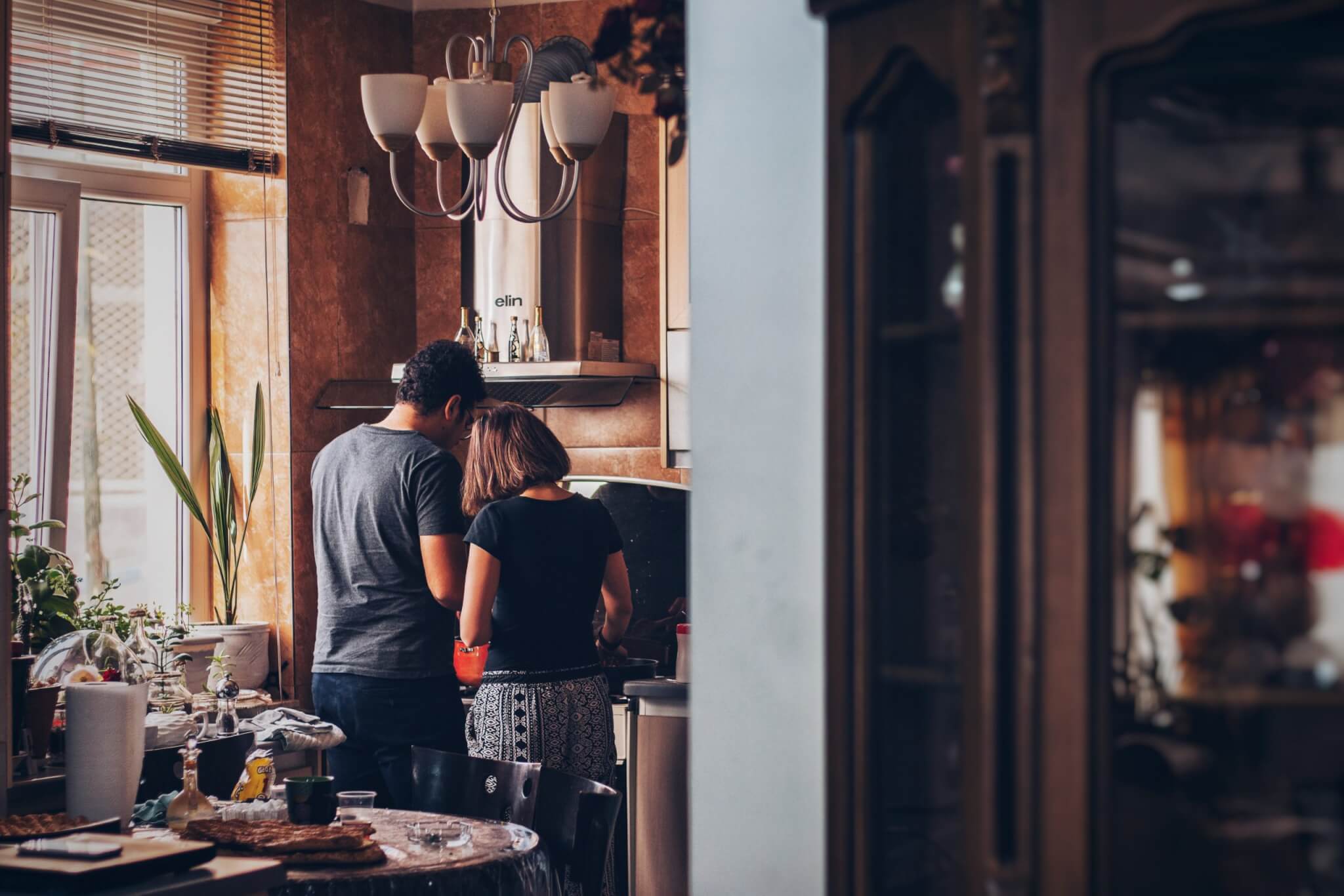 Couple Cooking Dinner in Kitchen