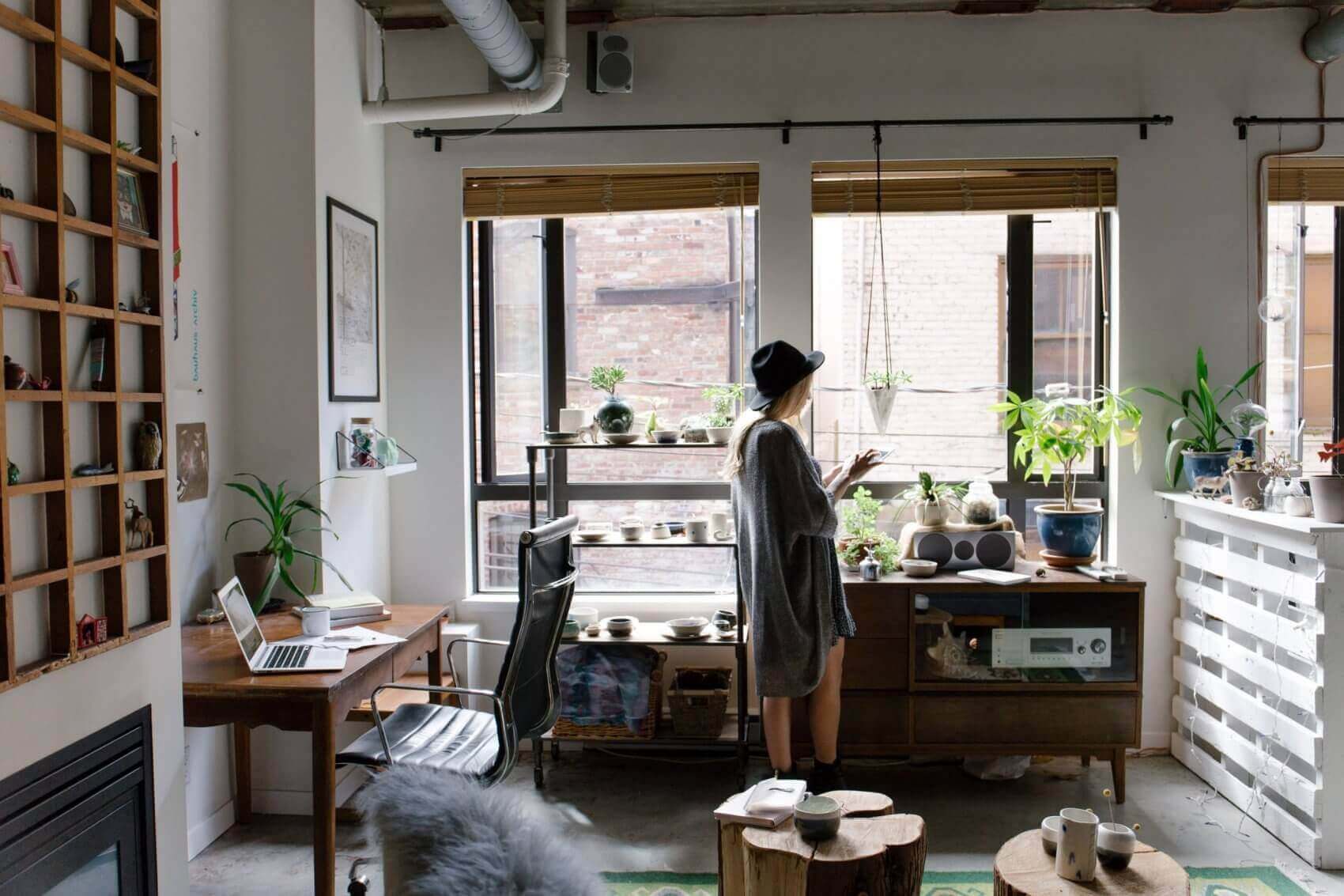 Woman with Hat Working on Tablet