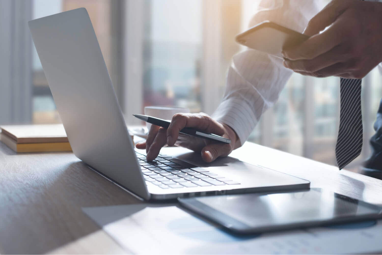 Gentleman in Suit on Laptop and Mobile
